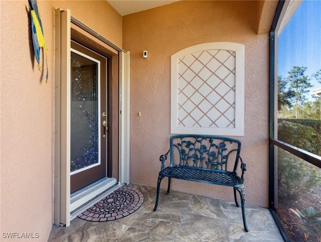 entrance to property featuring a balcony