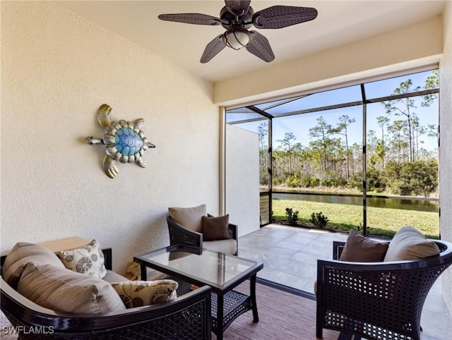 sunroom with ceiling fan