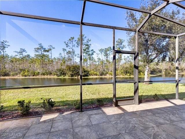 unfurnished sunroom with a water view