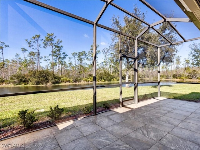 unfurnished sunroom with a water view