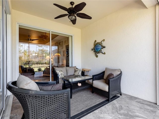 view of patio featuring ceiling fan and an outdoor living space