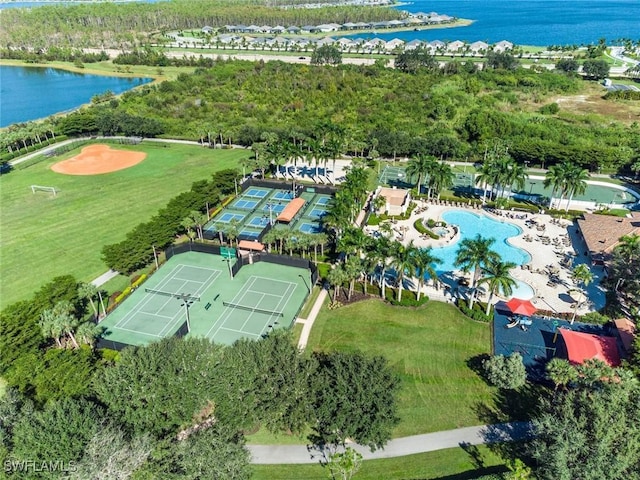 birds eye view of property with a water view