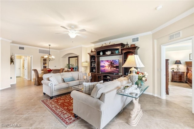 tiled living room featuring ornamental molding and ceiling fan with notable chandelier