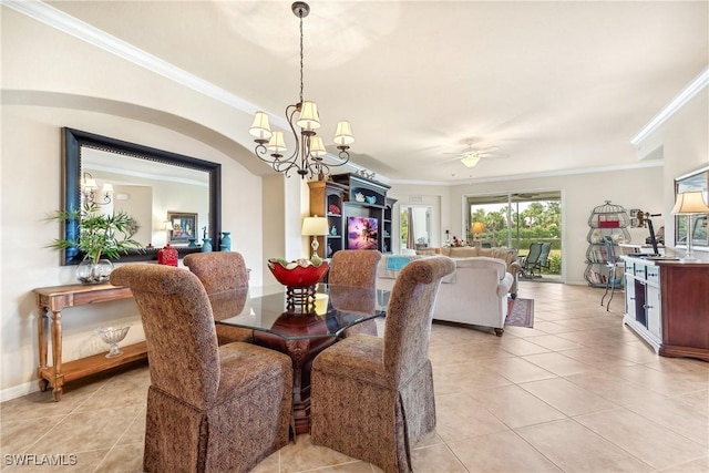 tiled dining space featuring crown molding and ceiling fan with notable chandelier