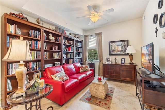 sitting room featuring ceiling fan