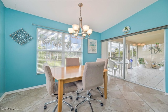 tiled dining space featuring lofted ceiling and a chandelier