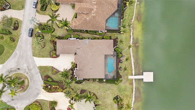 birds eye view of property with a water view