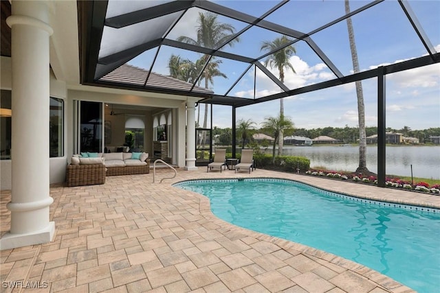 view of pool featuring ceiling fan, an outdoor living space, a patio area, a lanai, and a water view