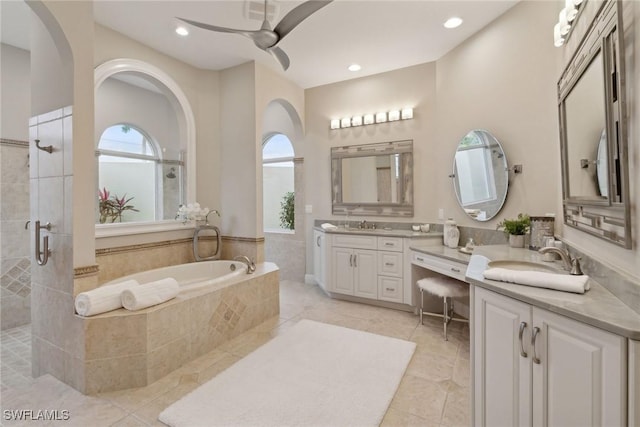 bathroom with separate shower and tub, vanity, ceiling fan, and tile patterned floors