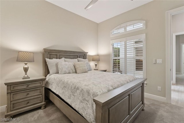 bedroom with dark colored carpet and ceiling fan