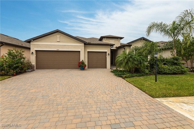 view of front facade with a front yard and a garage