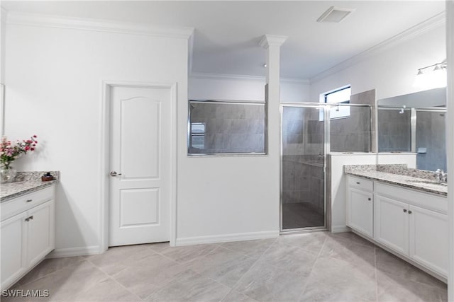 bathroom featuring an enclosed shower, tile patterned floors, vanity, ornate columns, and ornamental molding