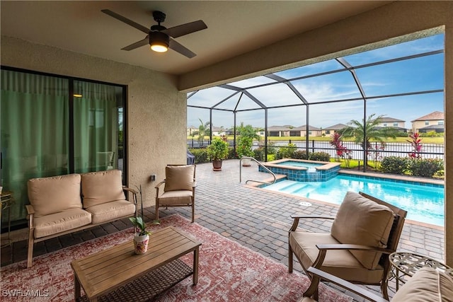 view of pool with an in ground hot tub, an outdoor hangout area, and a patio