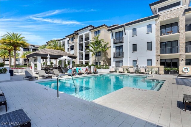 view of pool featuring a gazebo and a patio