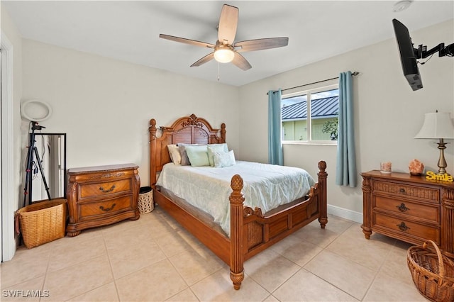 bedroom featuring light tile patterned floors and ceiling fan