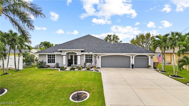 single story home featuring a garage and a front yard