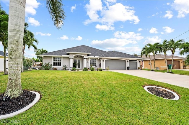 single story home featuring a garage and a front lawn