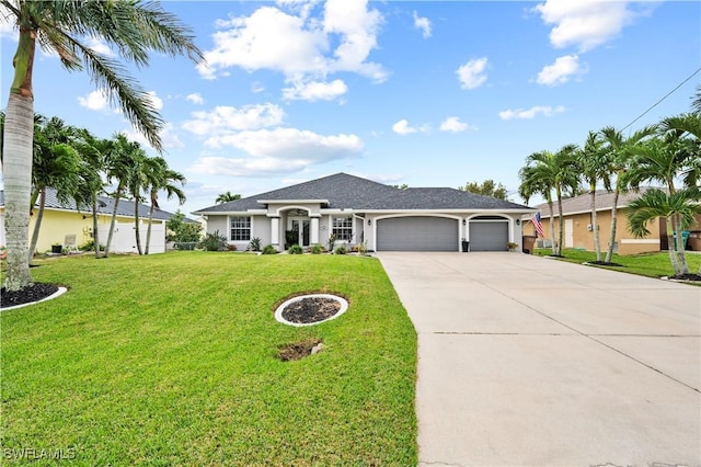 ranch-style home featuring a garage and a front lawn