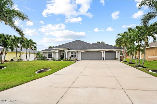 ranch-style home featuring a garage and a front yard