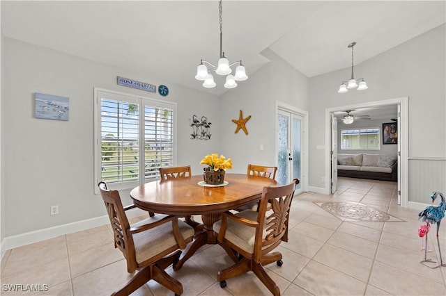 tiled dining area with an inviting chandelier