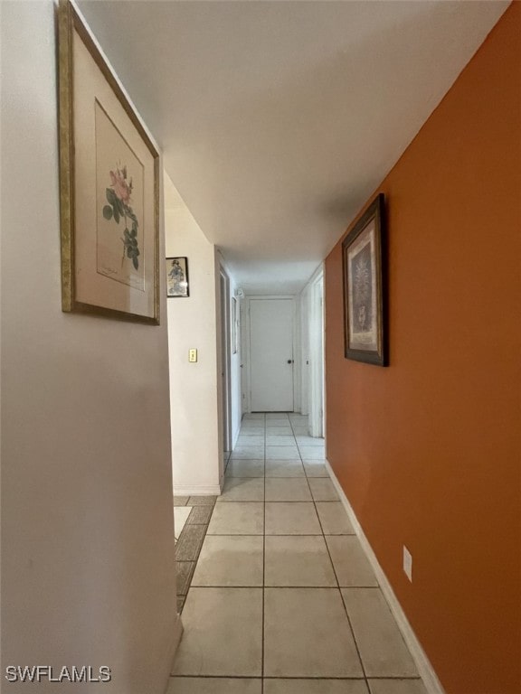 corridor with light tile patterned floors