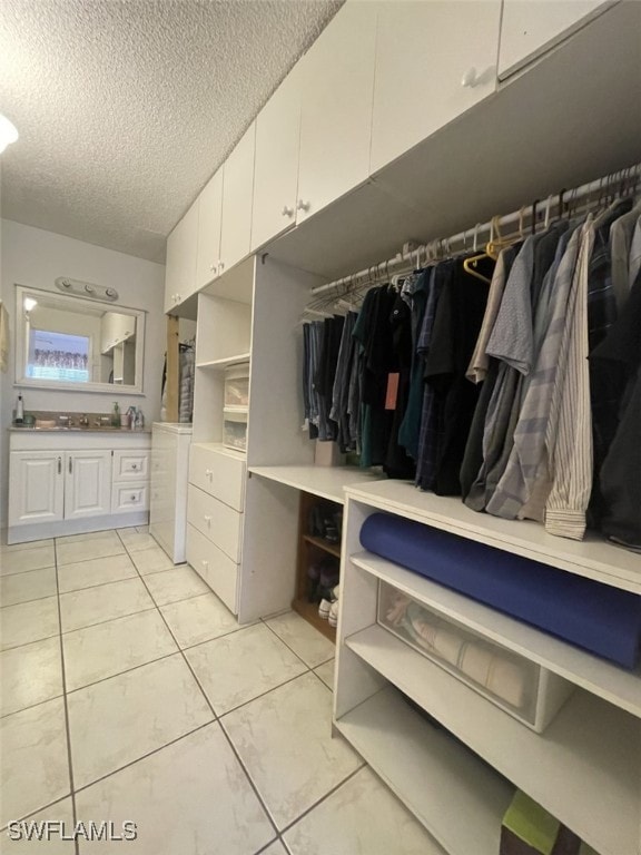 spacious closet with light tile patterned flooring