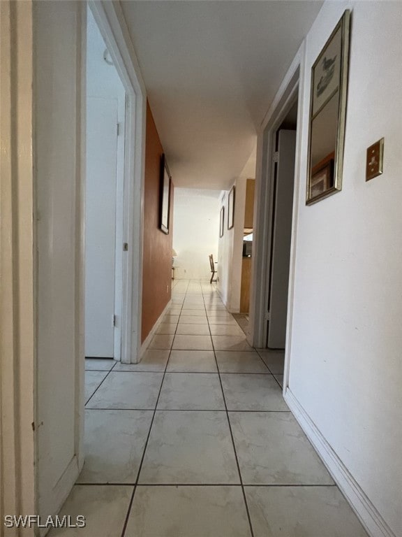 corridor featuring light tile patterned flooring