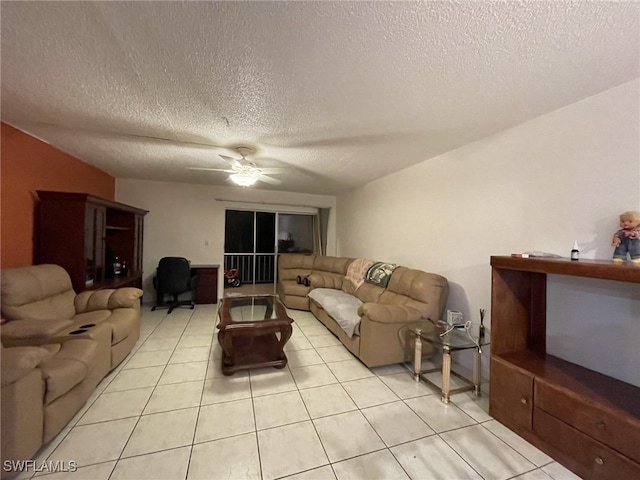 living room with a textured ceiling, light tile patterned flooring, and ceiling fan