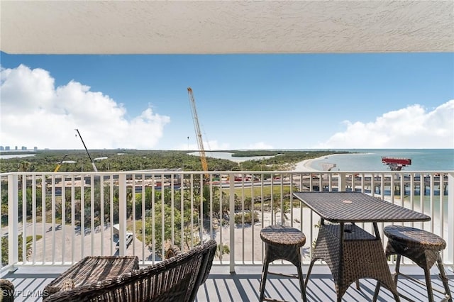 balcony featuring a water view