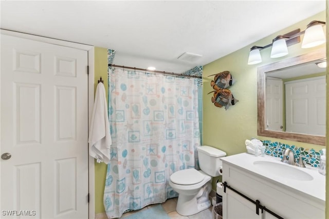 bathroom with toilet, vanity, and a shower with shower curtain