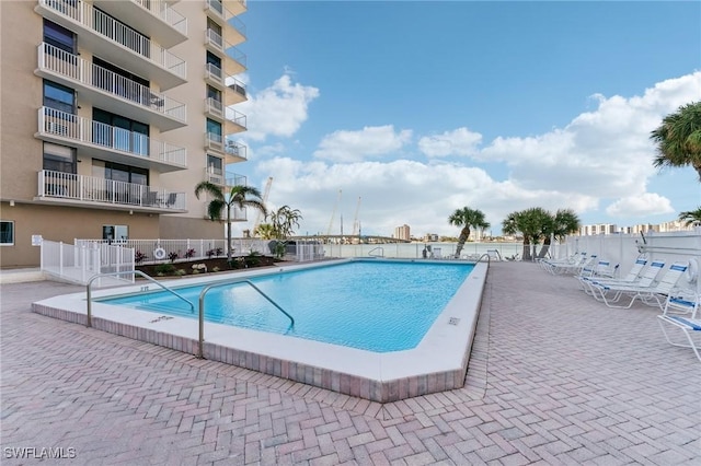 view of swimming pool with a patio