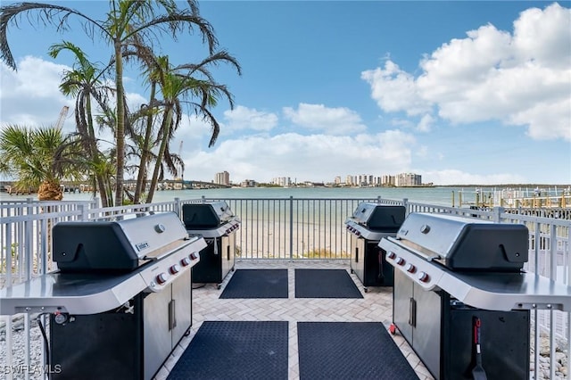 view of patio / terrace featuring a grill and a water view