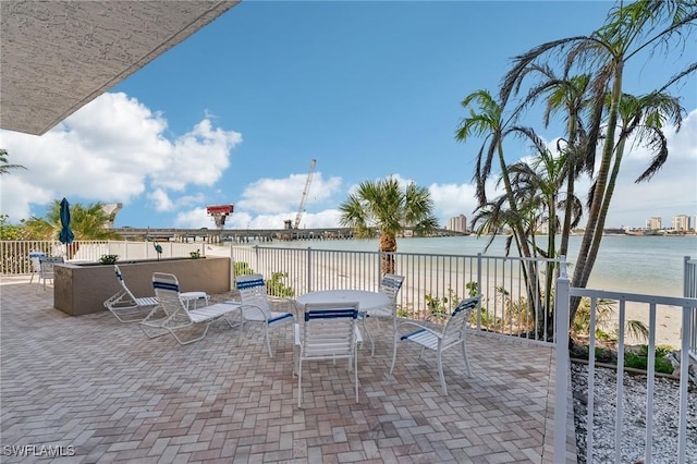 view of patio featuring a water view