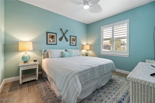 bedroom with hardwood / wood-style flooring and ceiling fan