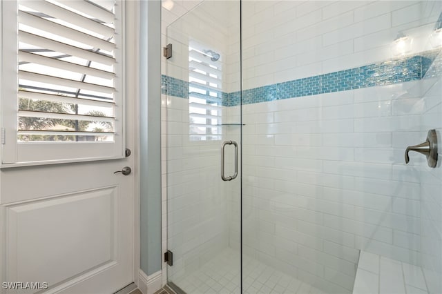 bathroom featuring an enclosed shower