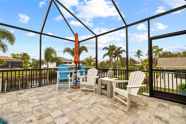 view of patio / terrace featuring a lanai