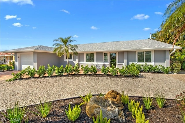 single story home featuring a garage