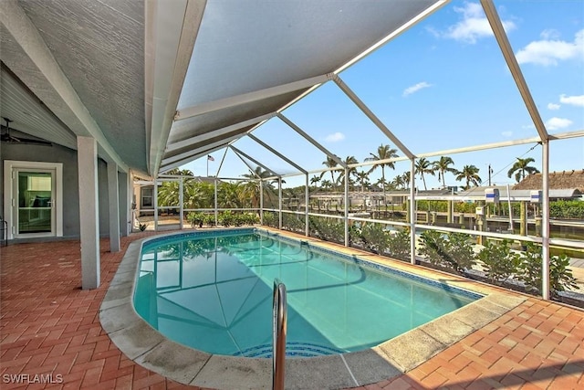 view of pool featuring a patio area and glass enclosure