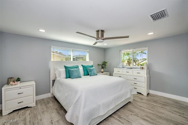 bedroom with ceiling fan and light wood-type flooring