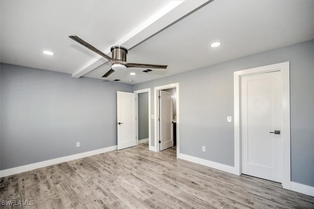 unfurnished bedroom with ceiling fan and light wood-type flooring