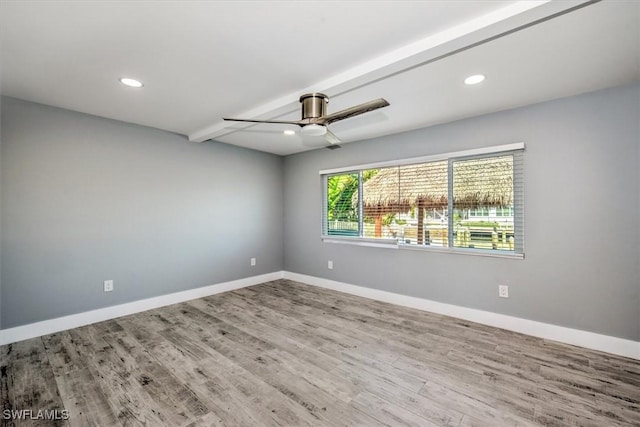 unfurnished room with ceiling fan and hardwood / wood-style floors