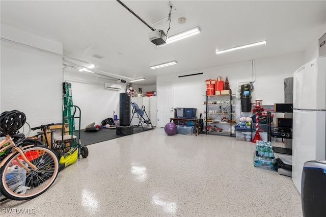 garage featuring a wall mounted AC and a garage door opener