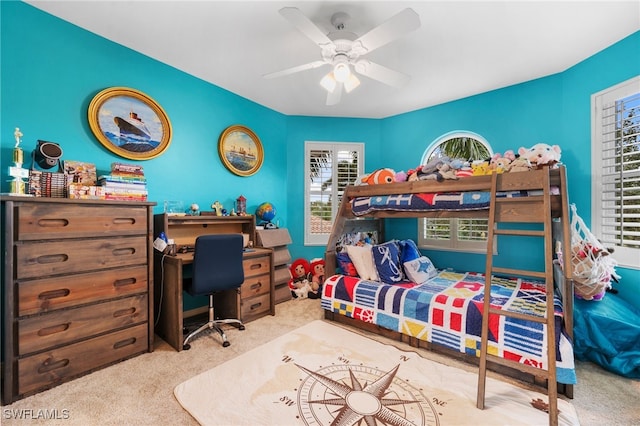 carpeted bedroom with ceiling fan