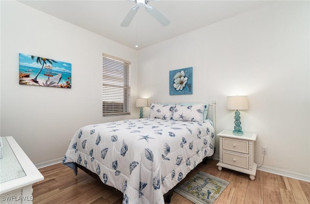 bedroom with ceiling fan and light wood-type flooring