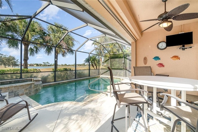 view of swimming pool with a lanai, a patio, ceiling fan, and a water view