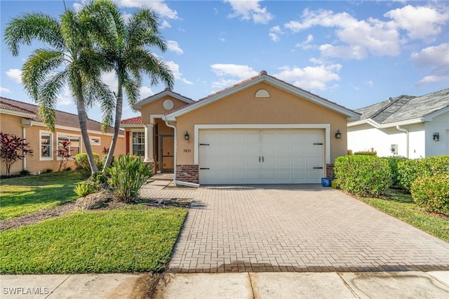 view of front facade featuring a front yard and a garage