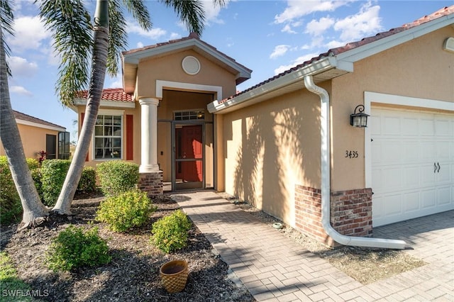 doorway to property featuring a garage