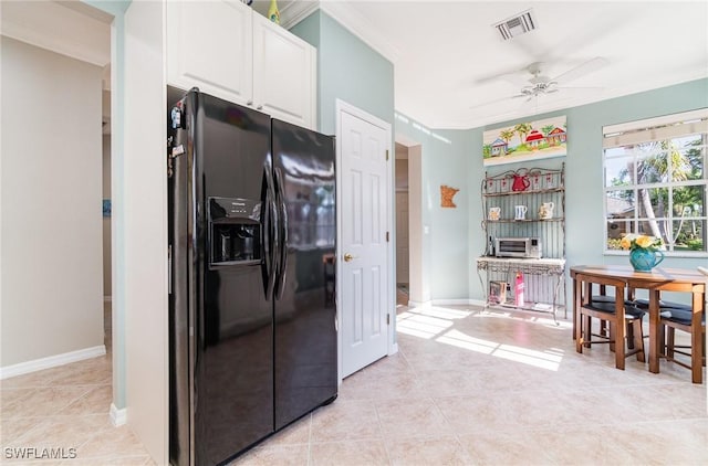 kitchen with white cabinetry, black refrigerator with ice dispenser, ceiling fan, light tile patterned floors, and crown molding