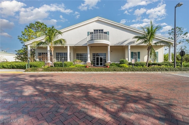 view of front of home with a balcony