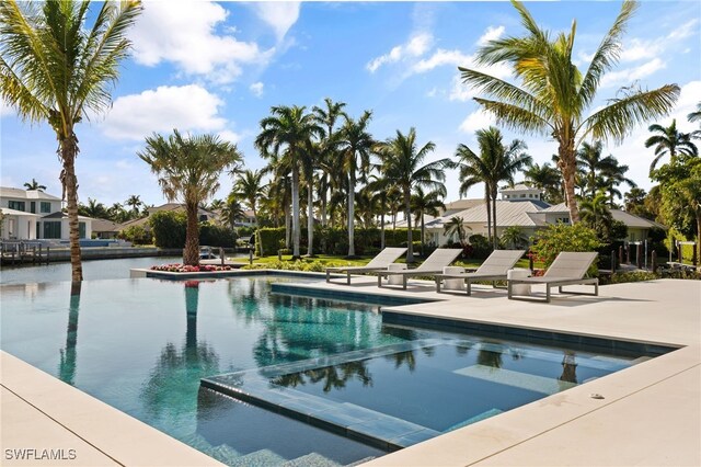 view of swimming pool featuring a patio area